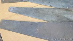 Four hand saws and square. Saws have some rust on blades and chips on handles. Longest saw measures