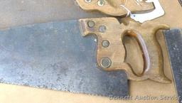 Four hand saws and square. Saws have some rust on blades and chips on handles. Longest saw measures