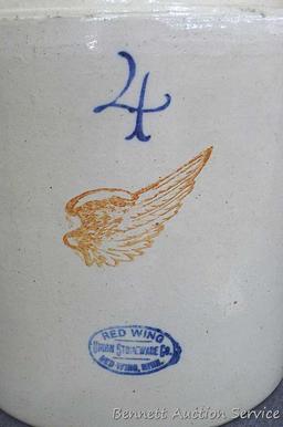 Redwing 4 gallon jug, Union Stoneware Co.; measures 11" x 17" tall. Chip noted on top edge of spout.