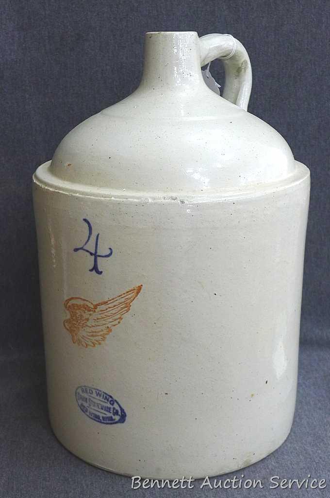 Redwing 4 gallon jug, Union Stoneware Co.; measures 11" x 17" tall. Chip noted on top edge of spout.