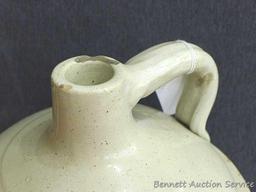 Redwing 4 gallon jug, Union Stoneware Co.; measures 11" x 17" tall. Chip noted on top edge of spout.