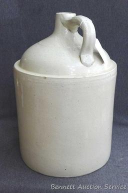Redwing 4 gallon jug, Union Stoneware Co.; measures 11" x 17" tall. Chip noted on top edge of spout.