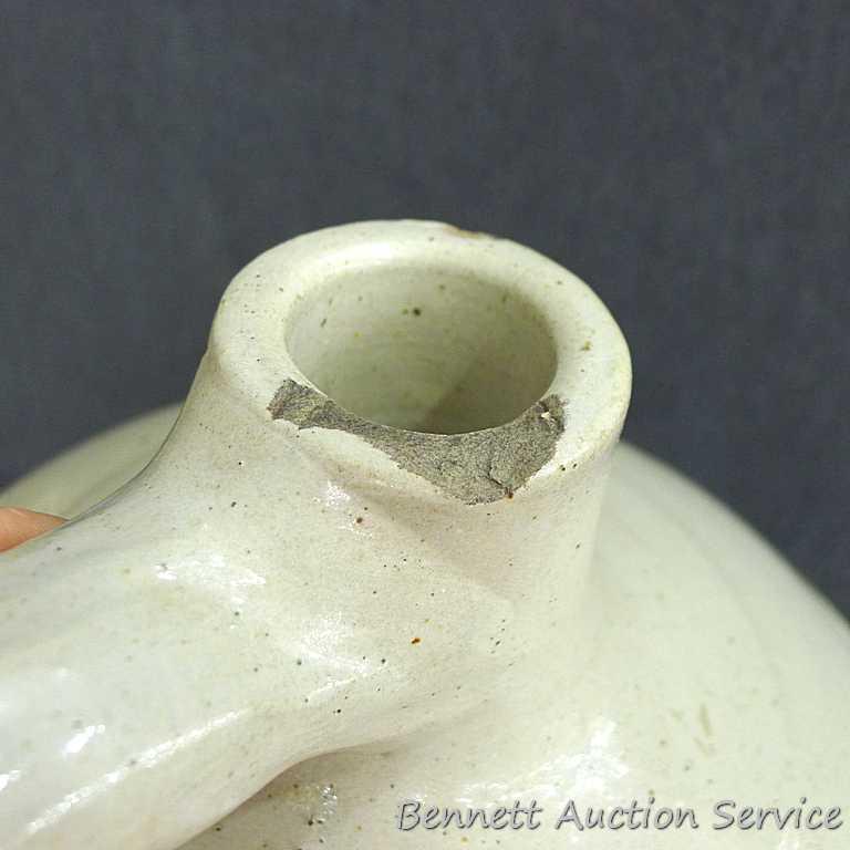Redwing 4 gallon jug, Union Stoneware Co.; measures 11" x 17" tall. Chip noted on top edge of spout.