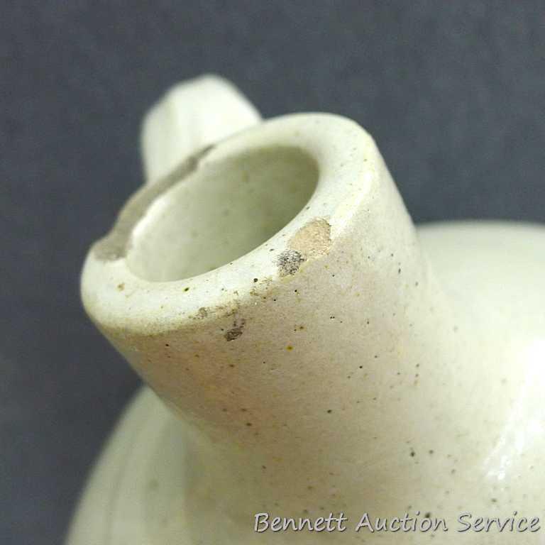 Redwing 4 gallon jug, Union Stoneware Co.; measures 11" x 17" tall. Chip noted on top edge of spout.