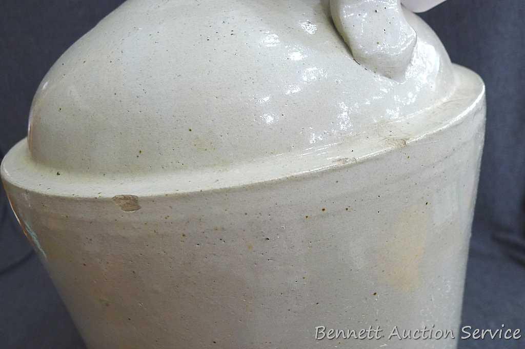 Redwing 4 gallon jug, Union Stoneware Co.; measures 11" x 17" tall. Chip noted on top edge of spout.