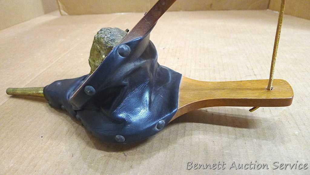 Two fireplace bellows up to 22" long. Small cracking noted on leather of larger ones, but both blow