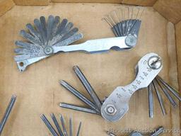 Craftsman and other feeler gauges, hex wrench sets, measuring tapes, plus a 3" miniature oil bottle.