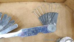 Craftsman and other feeler gauges, hex wrench sets, measuring tapes, plus a 3" miniature oil bottle.