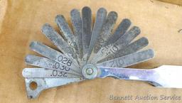 Craftsman and other feeler gauges, hex wrench sets, measuring tapes, plus a 3" miniature oil bottle.