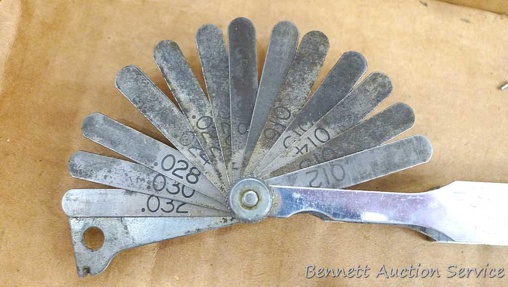 Craftsman and other feeler gauges, hex wrench sets, measuring tapes, plus a 3" miniature oil bottle.