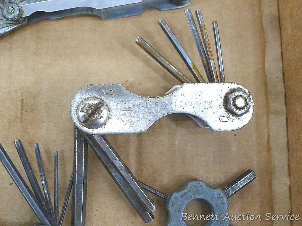 Craftsman and other feeler gauges, hex wrench sets, measuring tapes, plus a 3" miniature oil bottle.