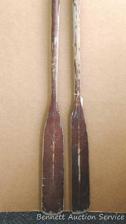 Pair of row boat oars which measure approx.. 83" x 5". Oars are worn but would restore or repurpose