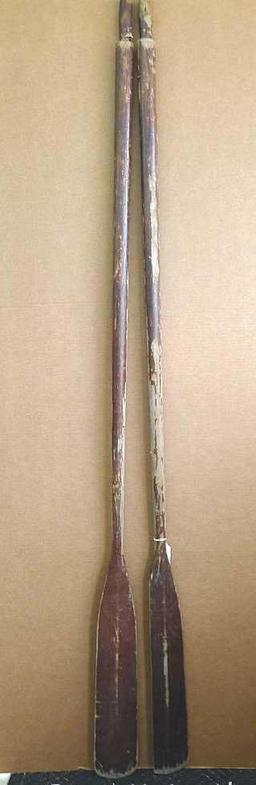 Pair of row boat oars which measure approx.. 83" x 5". Oars are worn but would restore or repurpose