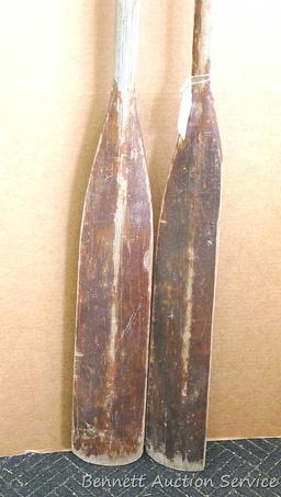 Pair of row boat oars which measure approx.. 83" x 5". Oars are worn but would restore or repurpose