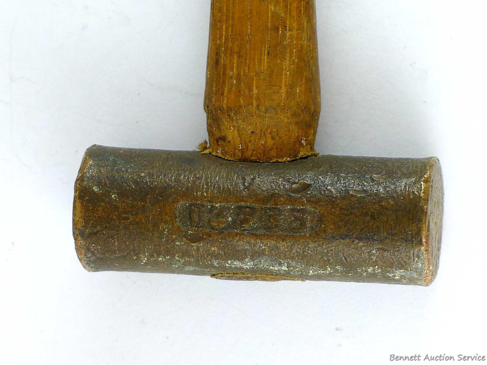 Cute little hammer with a brass head measures 7-3/4" overall. Brass head is nearly 3" wide.
