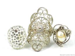 Three dainty silver colored rings size 7-1/2, 9, and 8-1/2. Cute pieces to add to your collection!