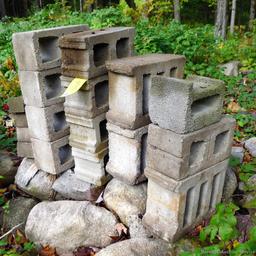 Concrete blocks and as much field stone as you care to haul. Take what you want and leave the rest.