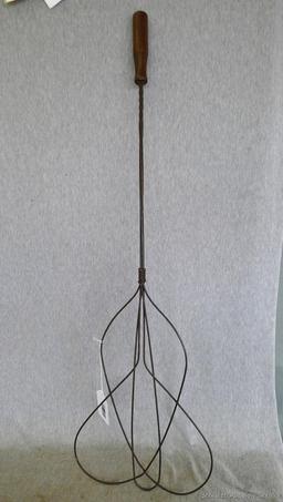 Antique rug beater is 33" long and in good shape.