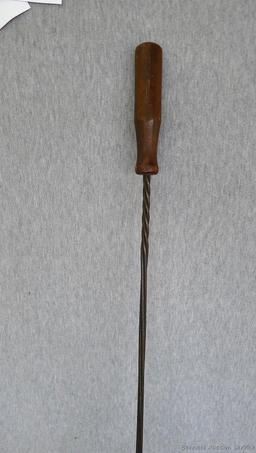 Antique rug beater is 33" long and in good shape.