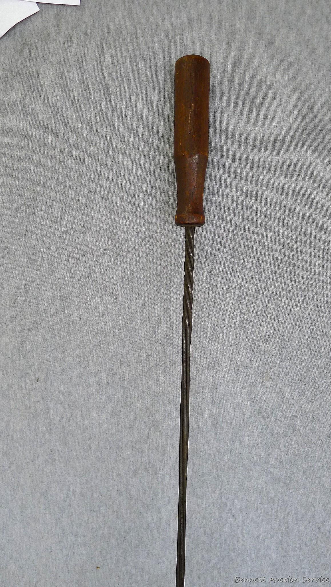 Antique rug beater is 33" long and in good shape.