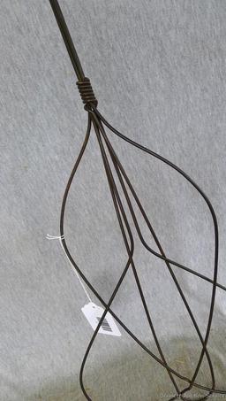 Antique rug beater is 33" long and in good shape.