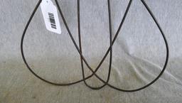 Antique rug beater is 33" long and in good shape.