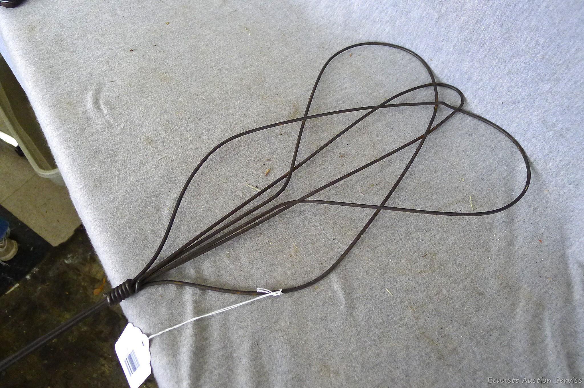 Antique rug beater is 33" long and in good shape.