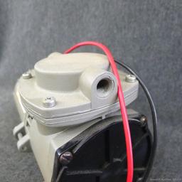 Thomas Model 107CDC18 air compressor/vacuum pump, 12 volt, untested.
