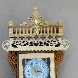 Beautiful ornate wall clock with scroll work; measures 11" x 5" x 30" tall. May need new battery.