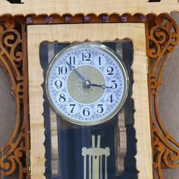 Beautiful ornate wall clock with scroll work; measures 11" x 5" x 30" tall. May need new battery.