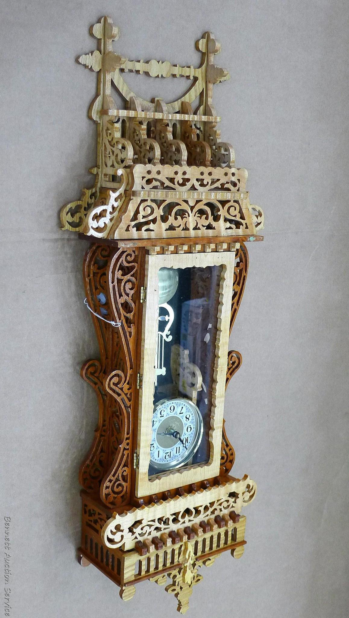 Beautiful ornate wall clock with scroll work; measures 11" x 5" x 30" tall. May need new battery.