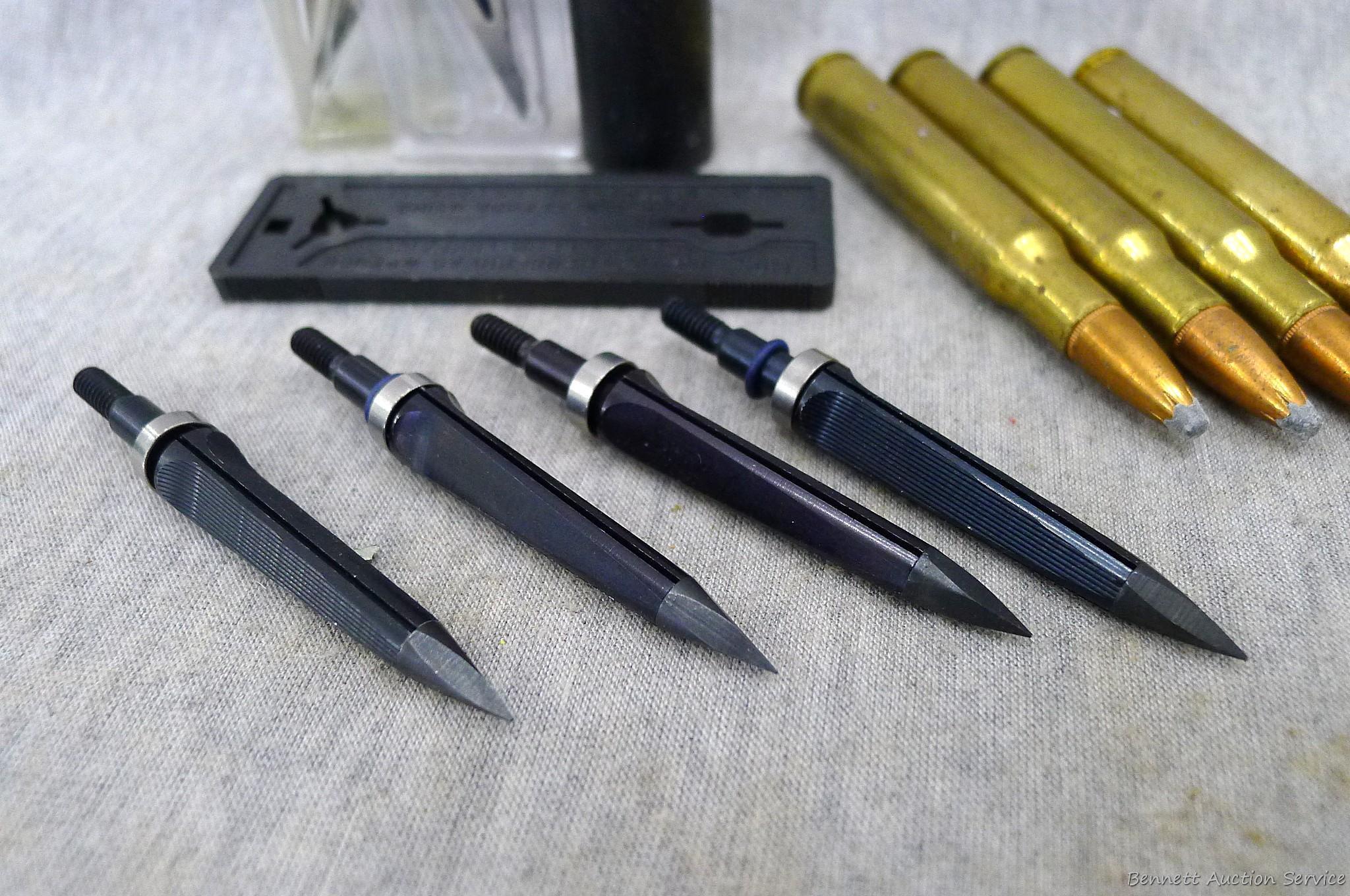 Four .30-06 cartridges four unassembled broadheads, one 12 gauge shot shell.