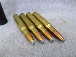 Four .30-06 cartridges four unassembled broadheads, one 12 gauge shot shell.