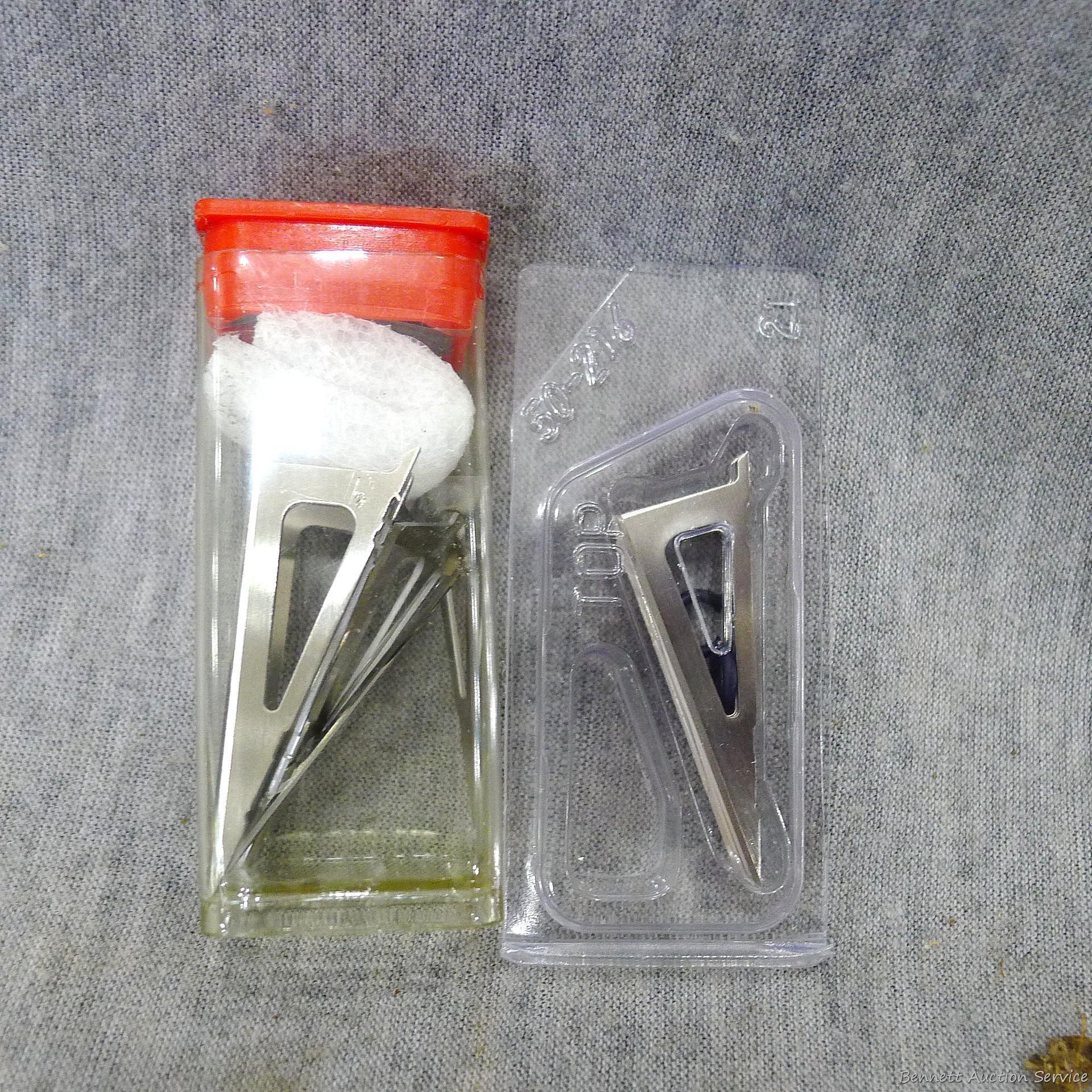 Four .30-06 cartridges four unassembled broadheads, one 12 gauge shot shell.