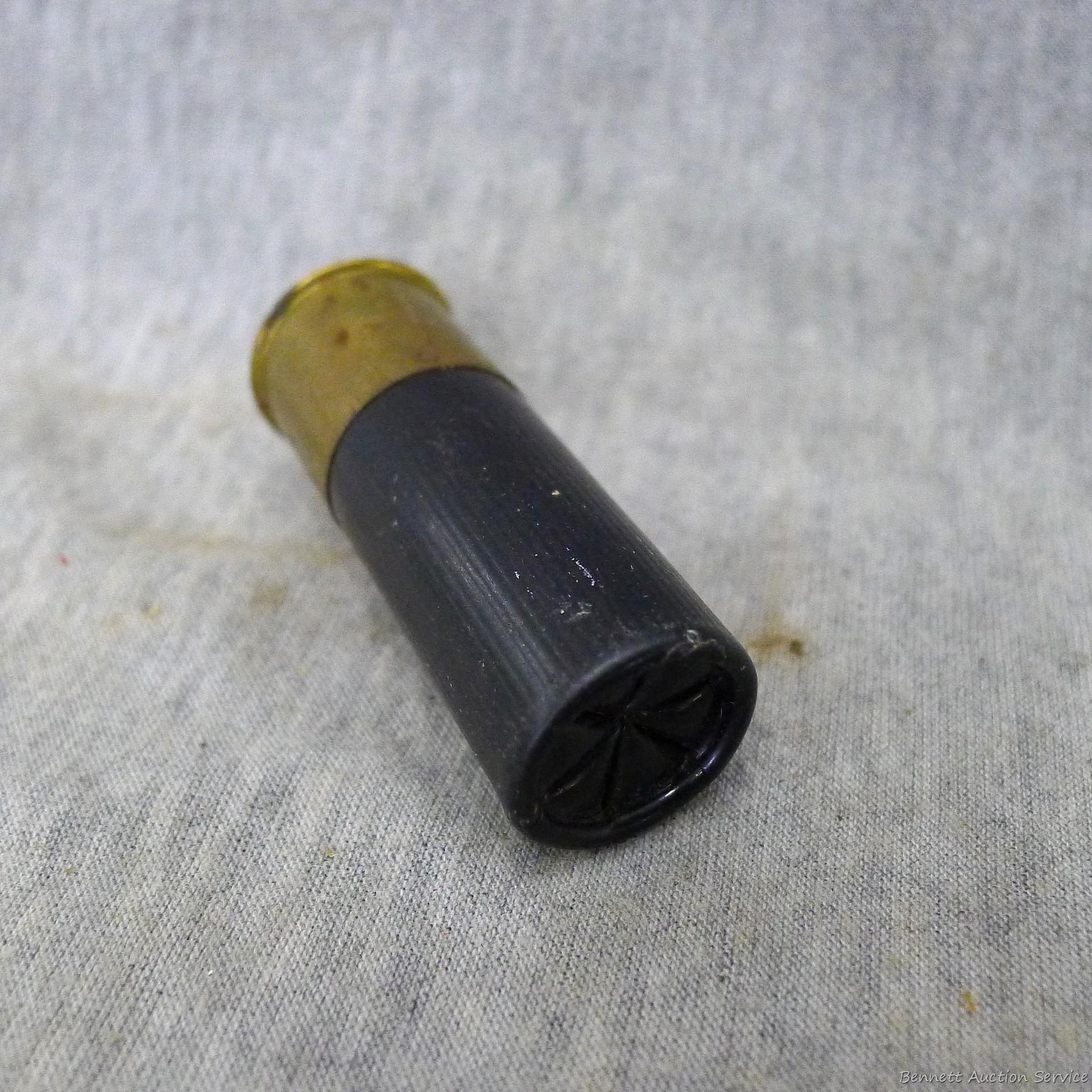 Four .30-06 cartridges four unassembled broadheads, one 12 gauge shot shell.