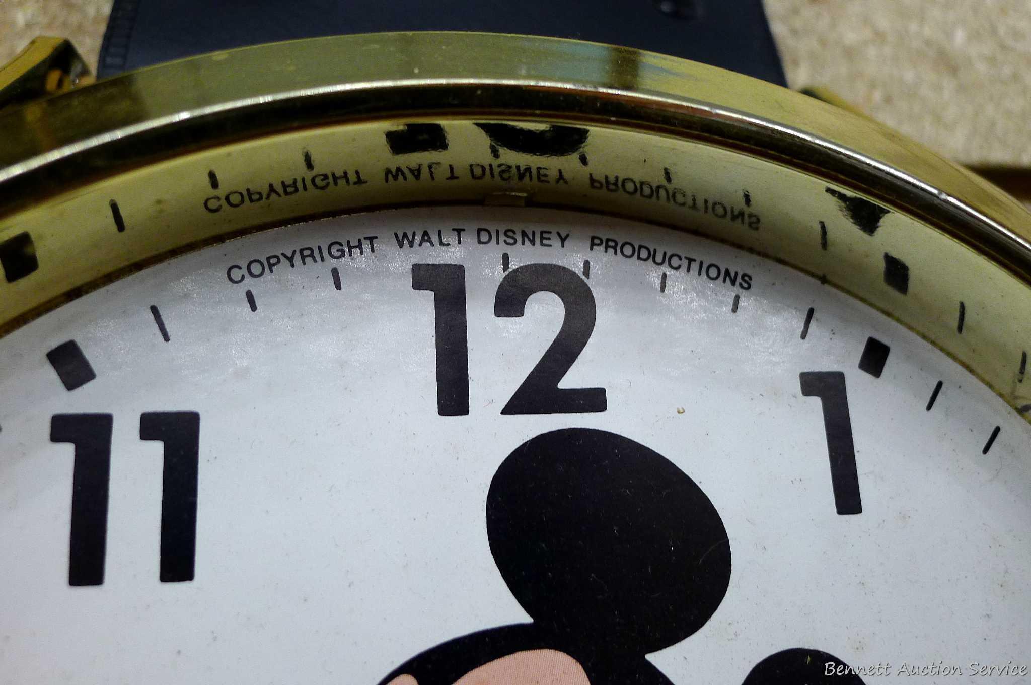 Mickey Mouse watch electric wall clock; measures 9" x 37". Seller states it works, is missing the