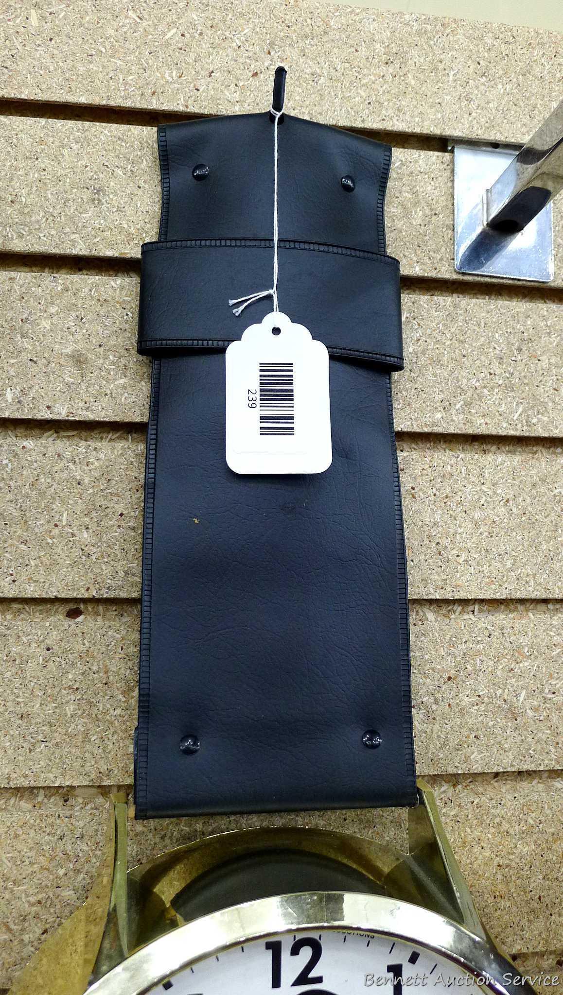 Mickey Mouse watch electric wall clock; measures 9" x 37". Seller states it works, is missing the
