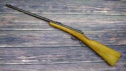 Savage Model 1911 bolt action boys rifle chambered .22 Short. 20" barrel is uniformly dark with weak