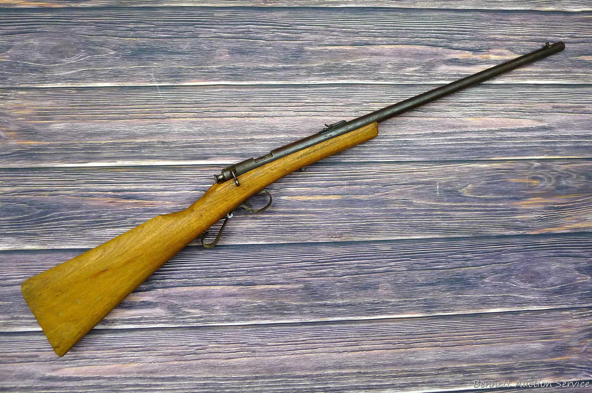 Savage Model 1911 bolt action boys rifle chambered .22 Short. 20" barrel is uniformly dark with weak