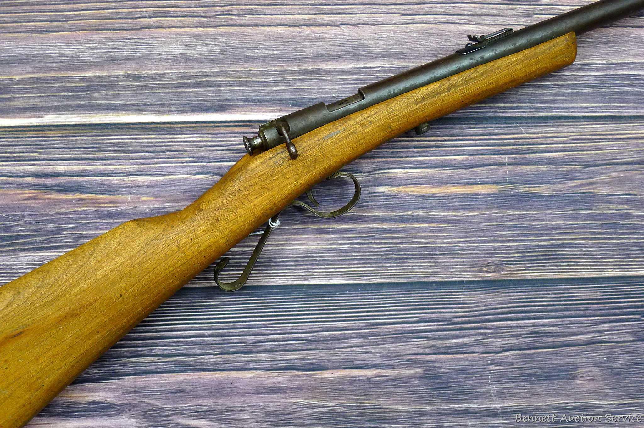 Savage Model 1911 bolt action boys rifle chambered .22 Short. 20" barrel is uniformly dark with weak