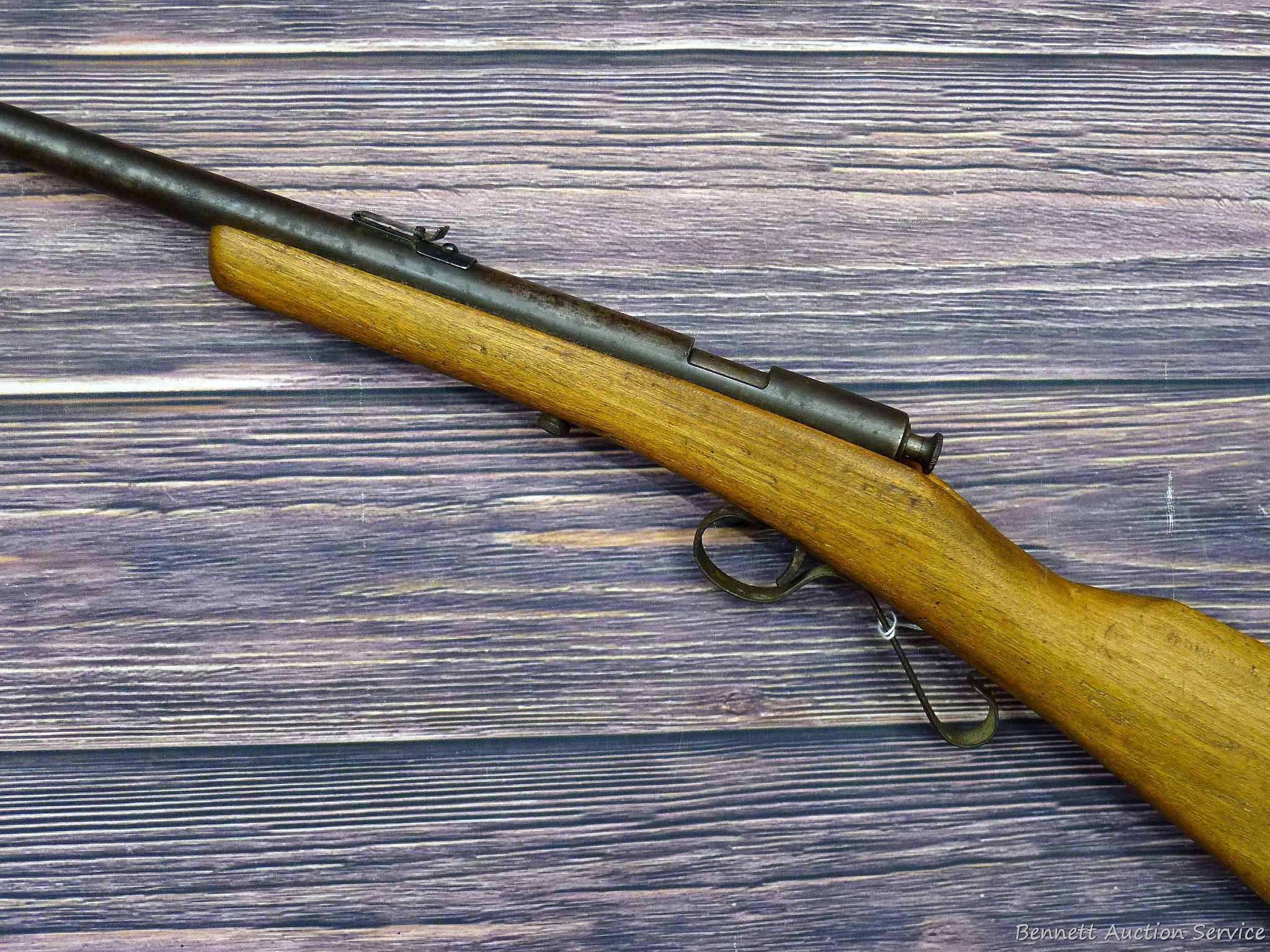 Savage Model 1911 bolt action boys rifle chambered .22 Short. 20" barrel is uniformly dark with weak