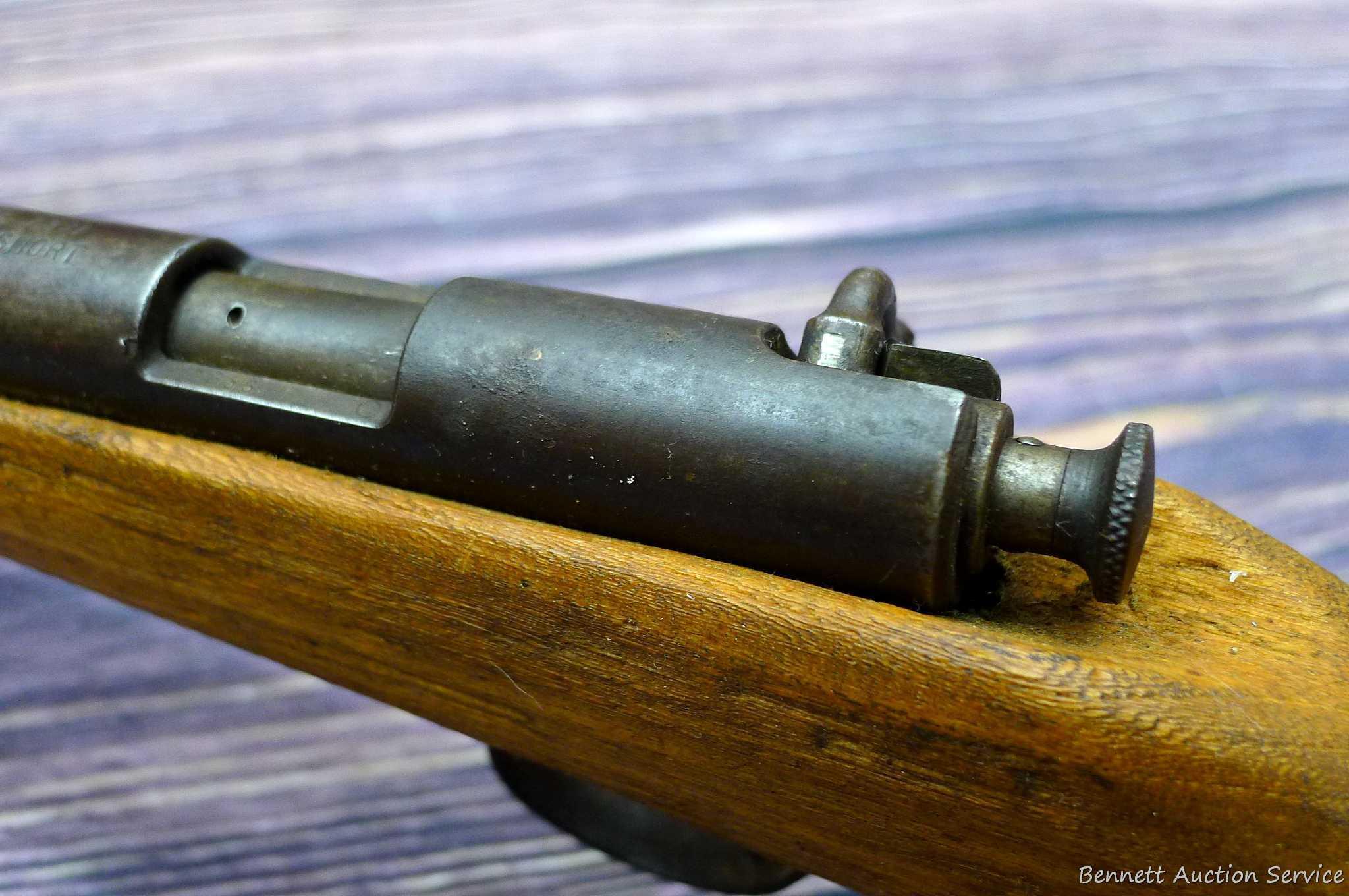 Savage Model 1911 bolt action boys rifle chambered .22 Short. 20" barrel is uniformly dark with weak