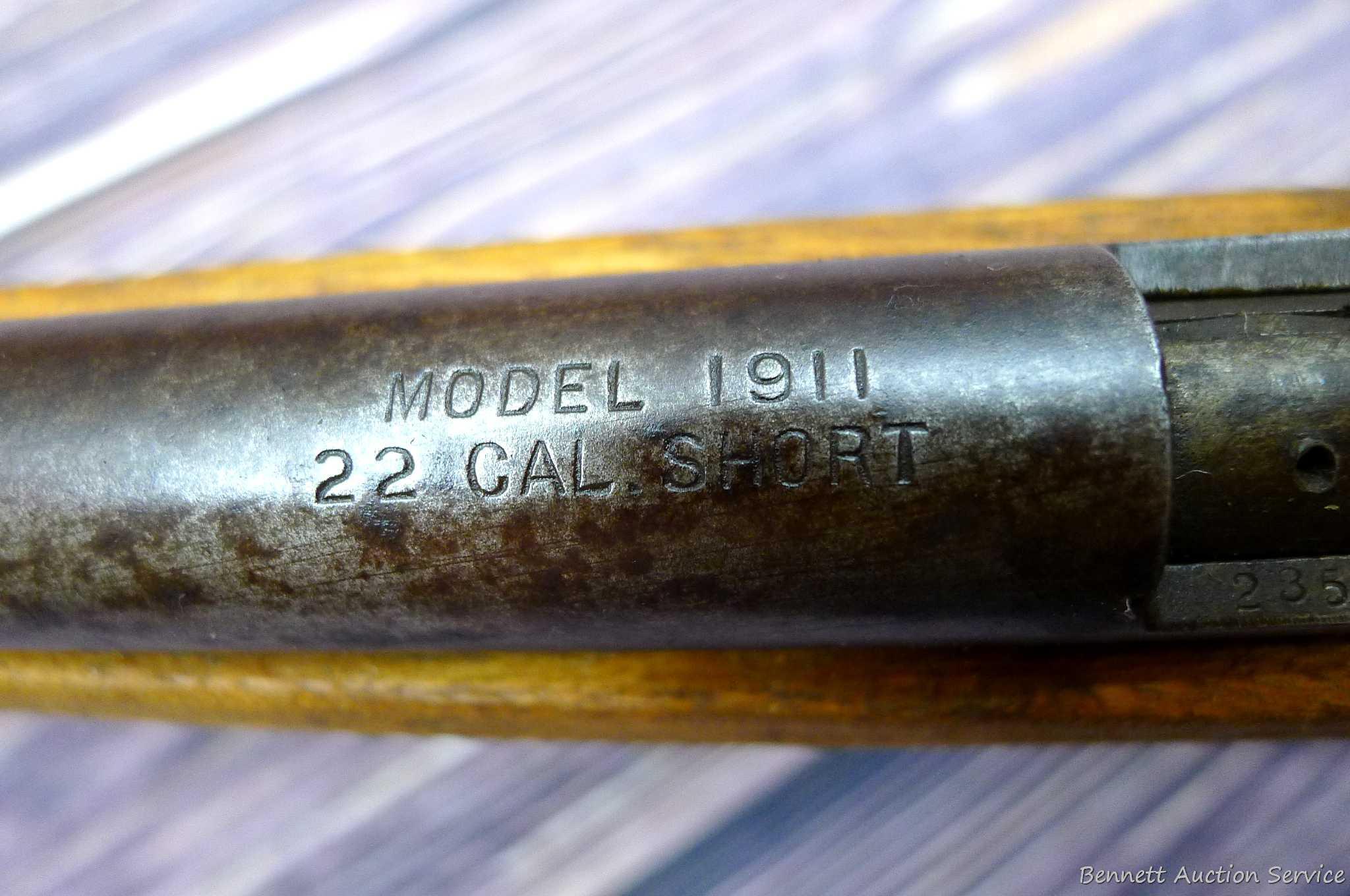 Savage Model 1911 bolt action boys rifle chambered .22 Short. 20" barrel is uniformly dark with weak
