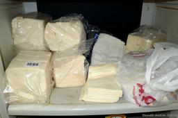 Large collection of disposable paper and cloth shop or cleaning rags.
