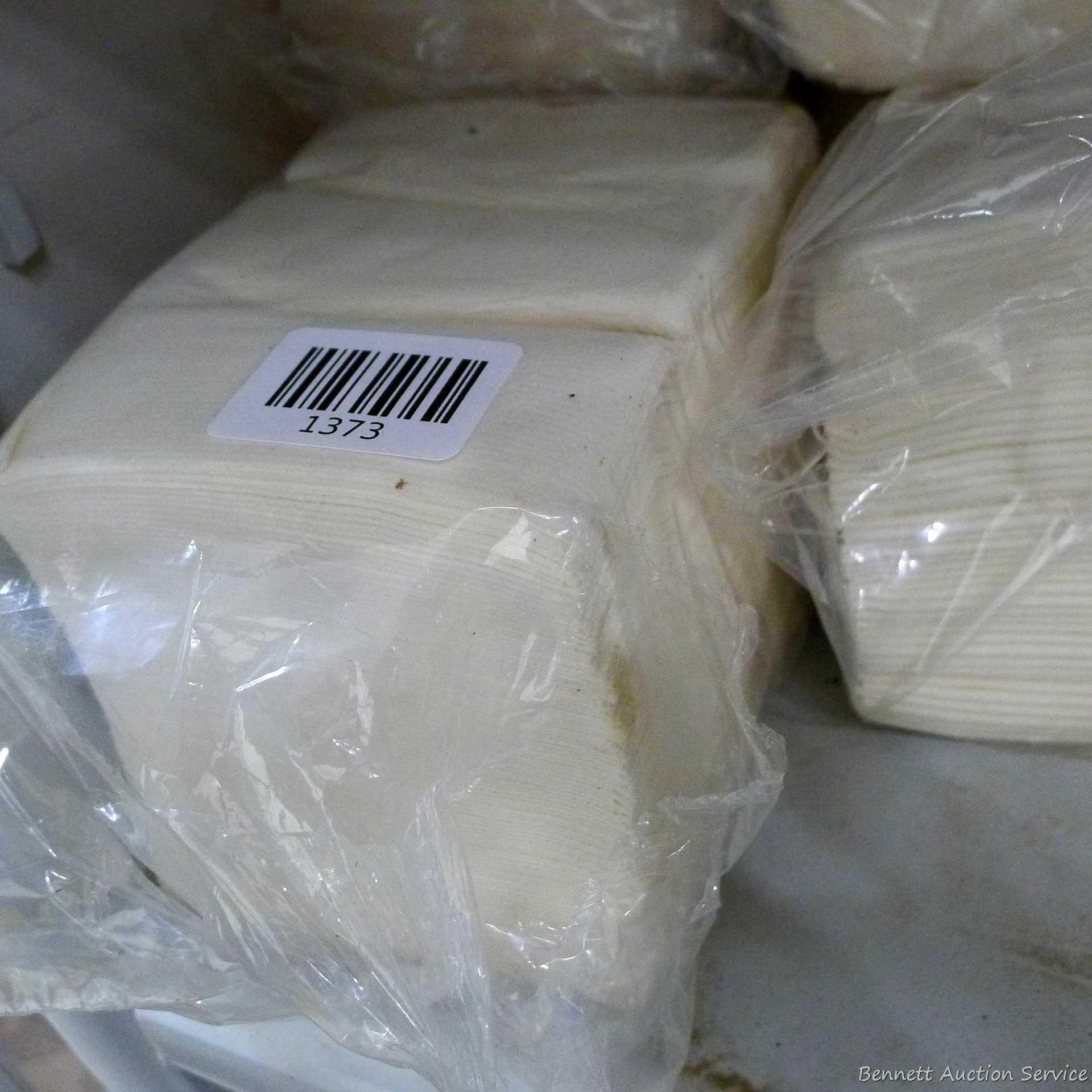 Large collection of disposable paper and cloth shop or cleaning rags.