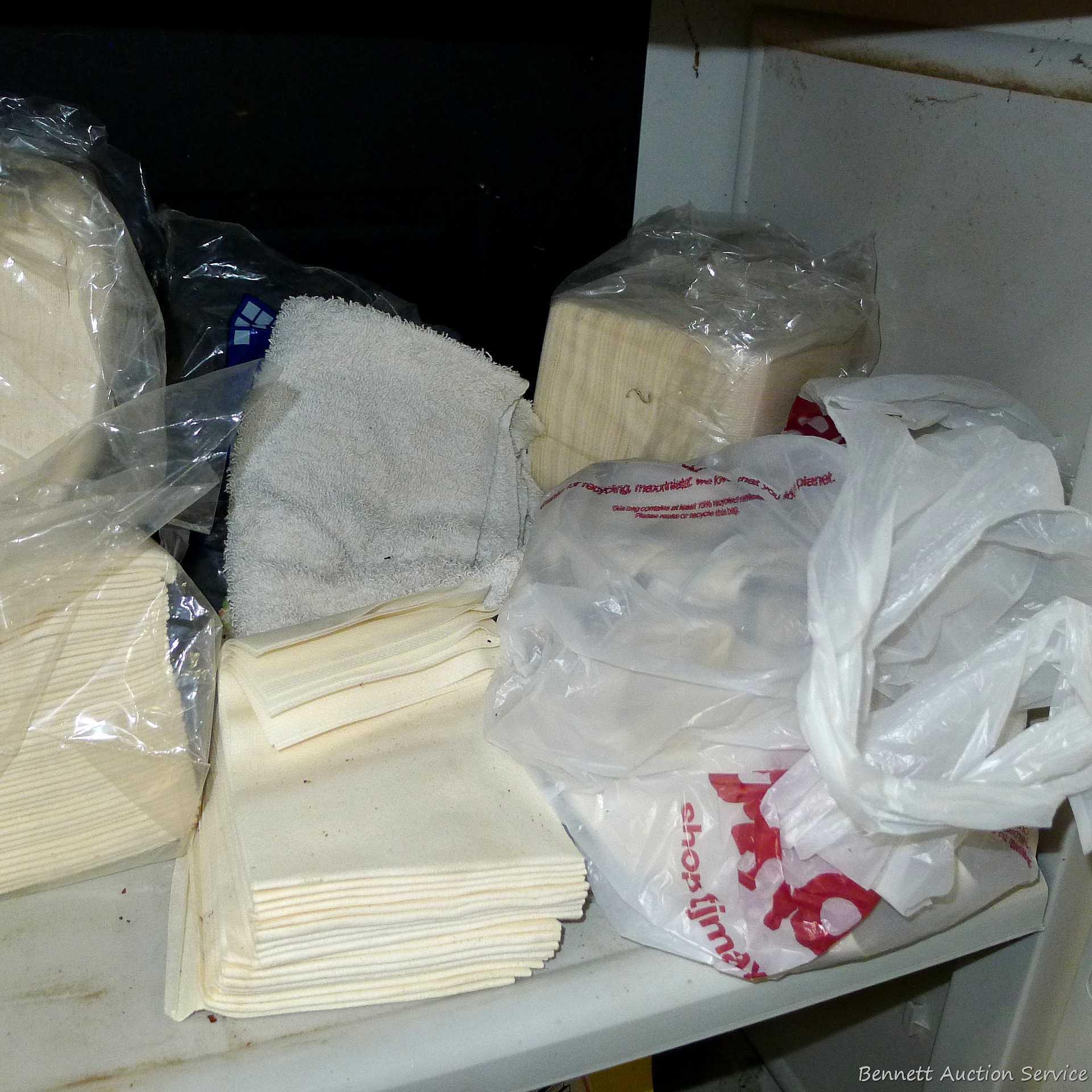 Large collection of disposable paper and cloth shop or cleaning rags.