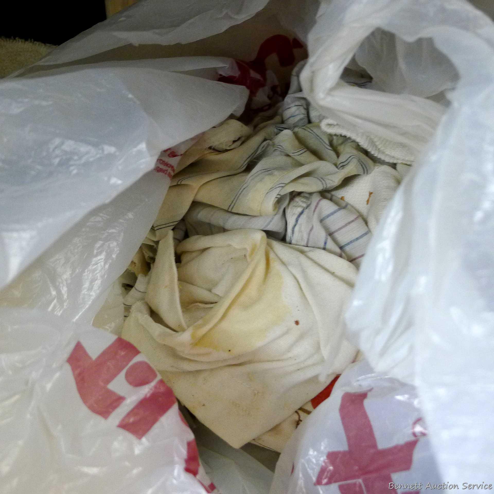 Large collection of disposable paper and cloth shop or cleaning rags.