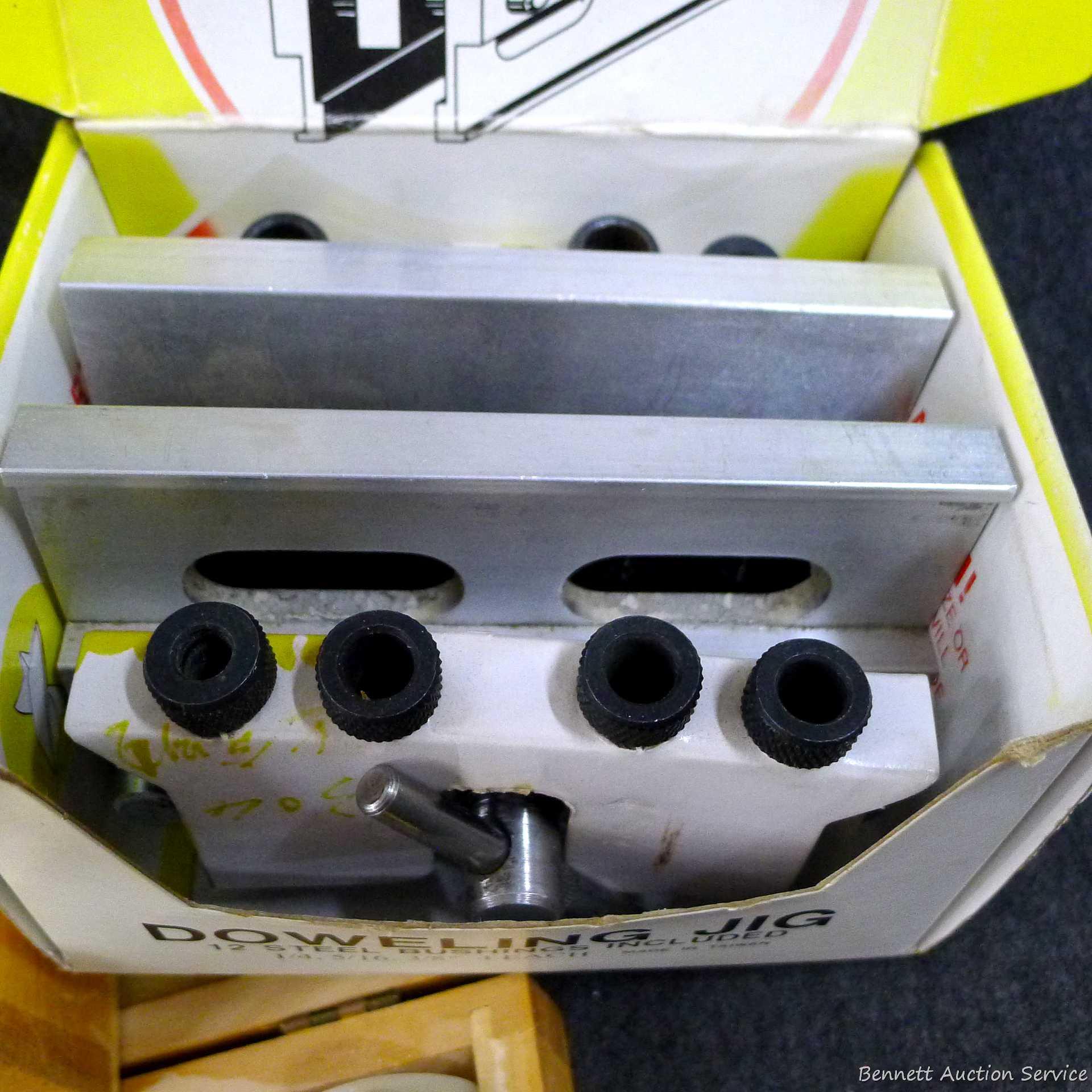4-3/4" doweling jig with 11 bushings, plug cutters, and a Forstner bit set up to 1". Forstner bits