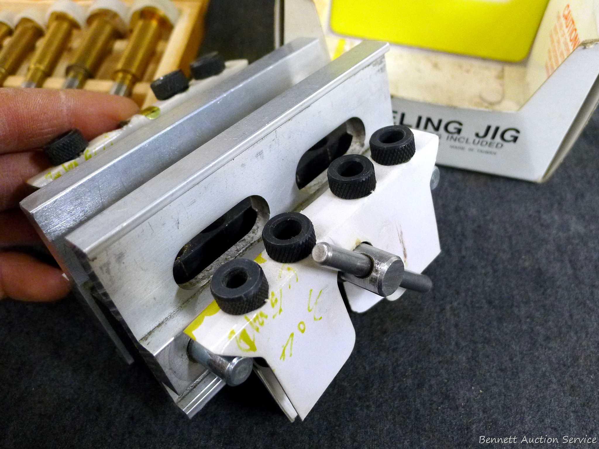 4-3/4" doweling jig with 11 bushings, plug cutters, and a Forstner bit set up to 1". Forstner bits
