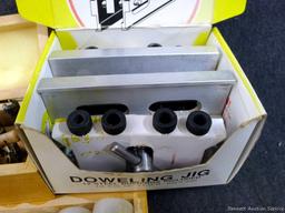 4-3/4" doweling jig with 11 bushings, plug cutters, and a Forstner bit set up to 1". Forstner bits
